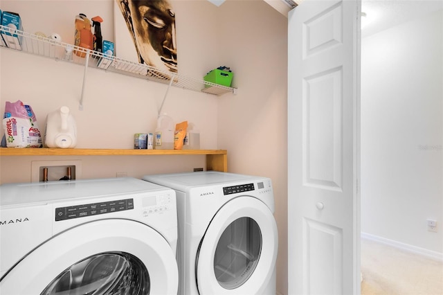 washroom featuring washing machine and clothes dryer