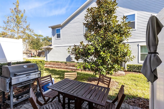 view of patio with outdoor dining area and area for grilling