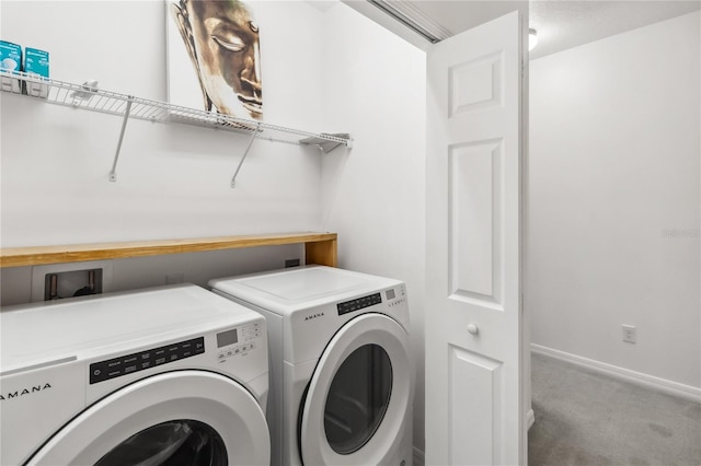 laundry area featuring laundry area, baseboards, separate washer and dryer, and carpet flooring