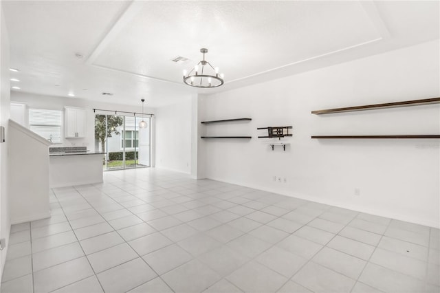 interior space featuring visible vents, a notable chandelier, and light tile patterned floors