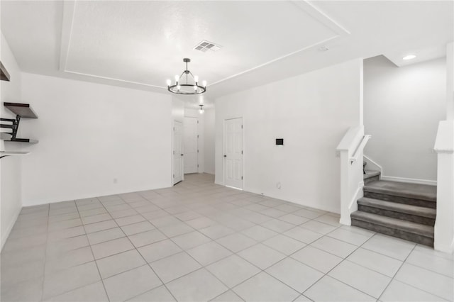 unfurnished dining area with stairs, light tile patterned flooring, a chandelier, and visible vents