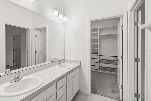 full bathroom with double vanity and a sink