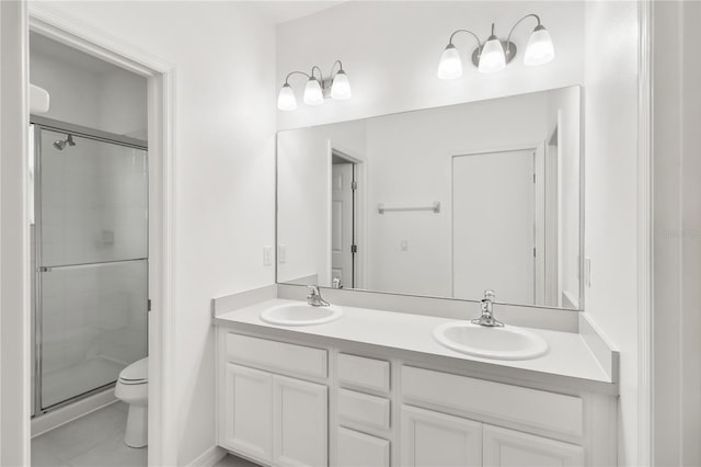 1311 E 10th St, Apopka, FL 32703 - full bathroom featuring double vanity, a shower stall, and tile patterned flooring