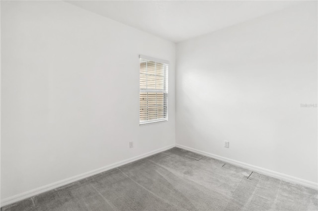 1311 E 10th St, Apopka, FL 32703 - empty room featuring baseboards and light carpet