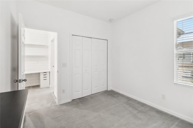 1311 E 10th St, Apopka, FL 32703 - unfurnished bedroom featuring light colored carpet and a closet