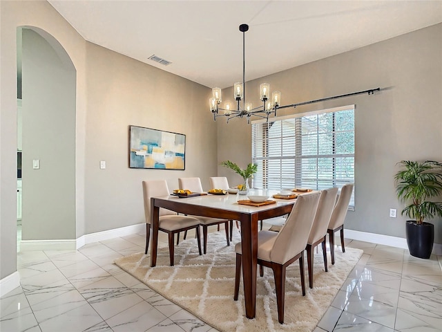 dining room with a chandelier