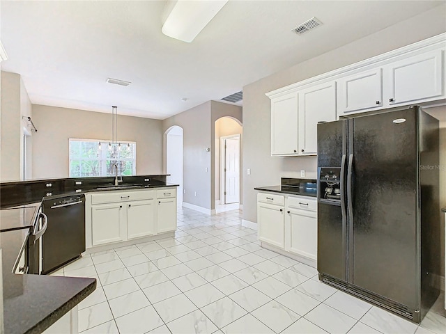 kitchen featuring black appliances, hanging light fixtures, white cabinets, and sink