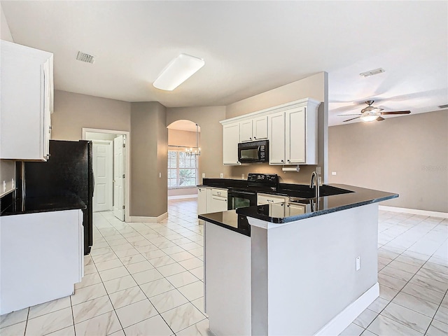 kitchen with black appliances, kitchen peninsula, ceiling fan, white cabinets, and sink