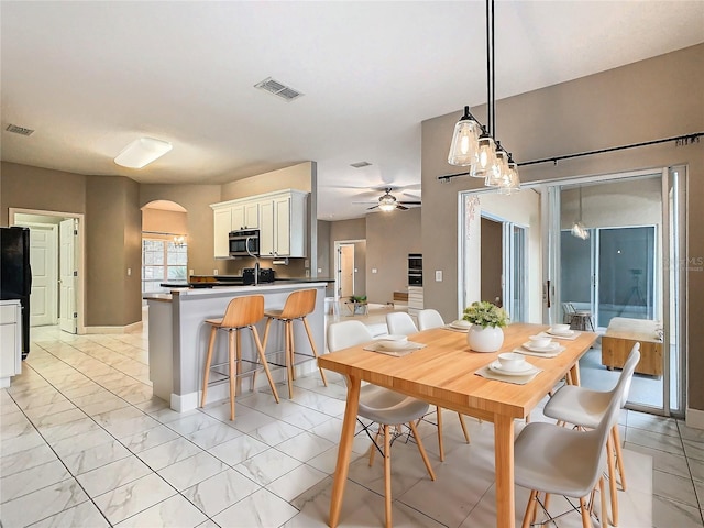 dining room featuring ceiling fan