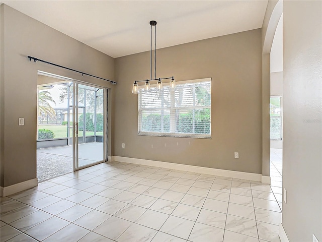 unfurnished dining area featuring light tile patterned floors