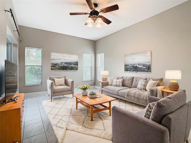 tiled living room featuring ceiling fan