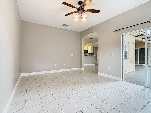 spare room with ceiling fan