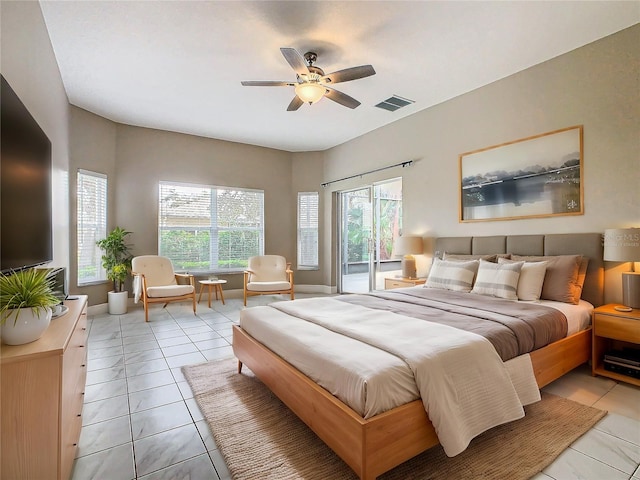 tiled bedroom with access to outside and ceiling fan