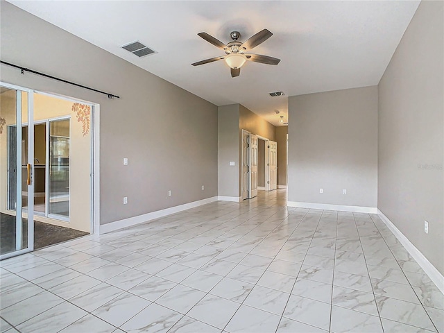 spare room with ceiling fan