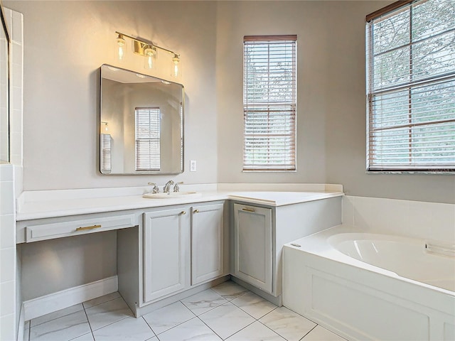 bathroom featuring a washtub and vanity