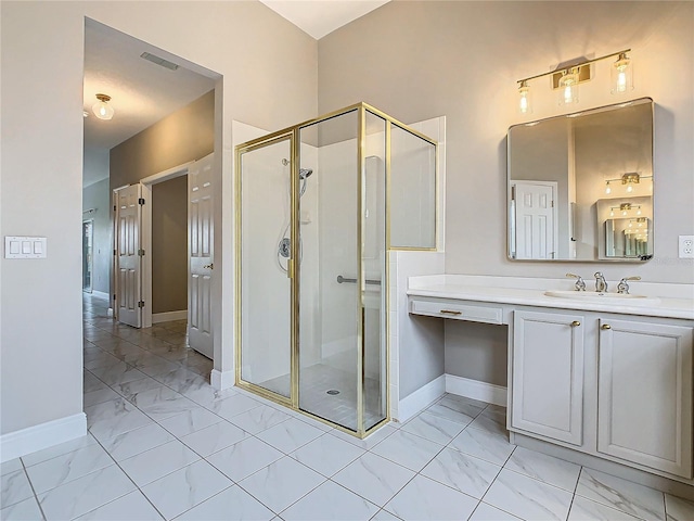 bathroom with a shower with shower door and vanity