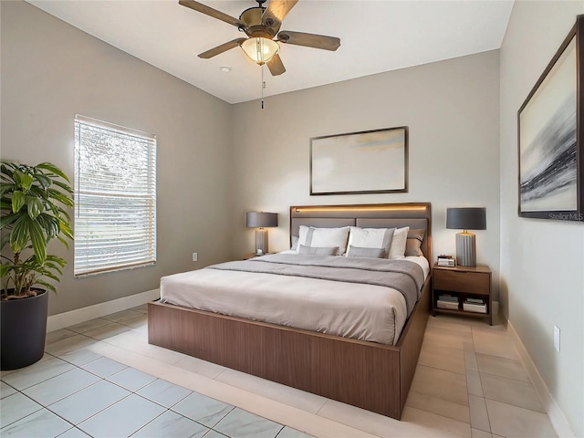 bedroom with light tile patterned flooring and ceiling fan