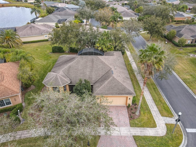 birds eye view of property with a water view