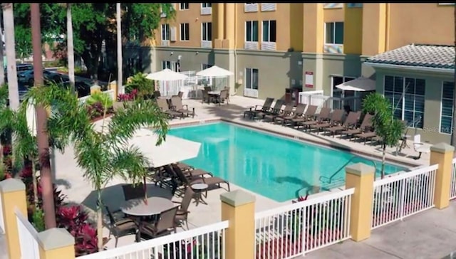 view of swimming pool featuring a patio