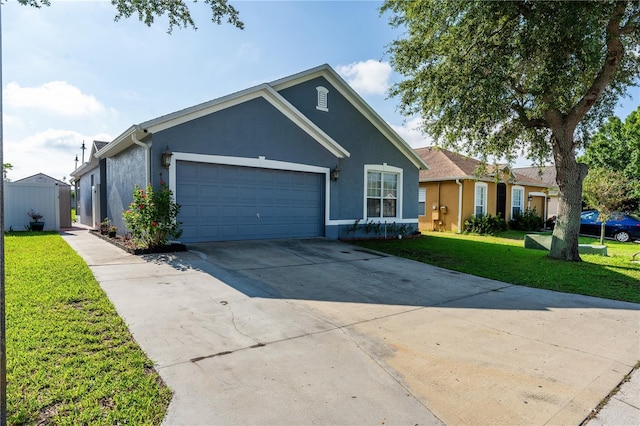 single story home with a front yard and a garage