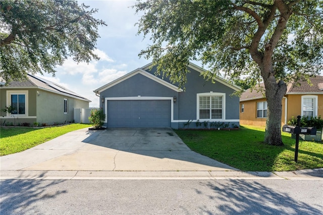 ranch-style house with a front lawn and a garage