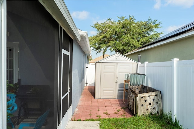 exterior space featuring a patio area and a shed