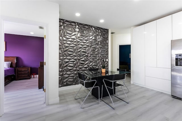 dining area with light hardwood / wood-style floors