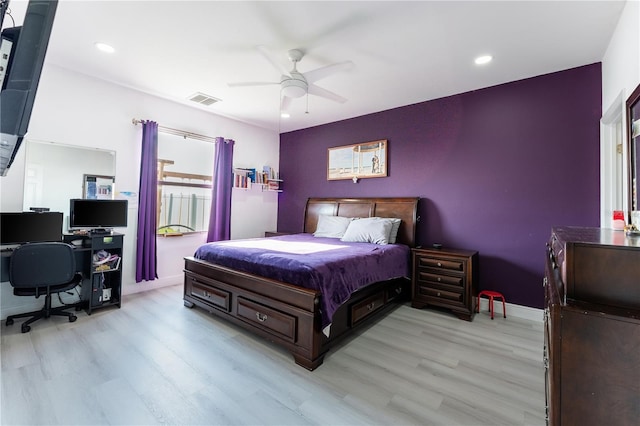 bedroom with ceiling fan and light hardwood / wood-style flooring