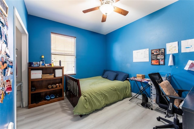 bedroom featuring hardwood / wood-style flooring and ceiling fan