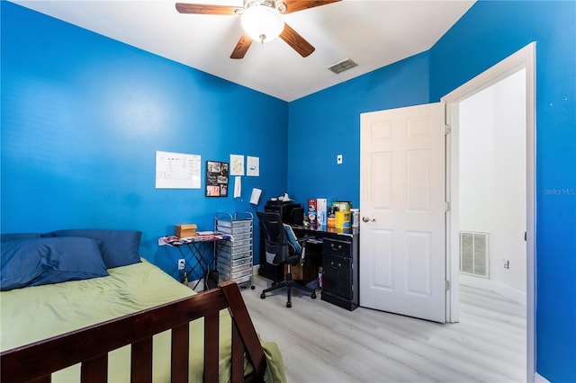 bedroom with ceiling fan and light wood-type flooring