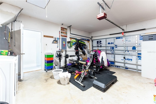 garage with a garage door opener and electric panel