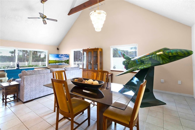 tiled dining area with beam ceiling, high vaulted ceiling, and ceiling fan with notable chandelier