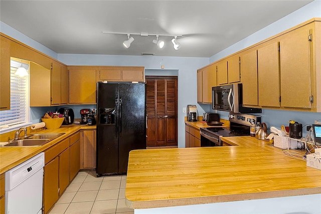 kitchen with black fridge with ice dispenser, white dishwasher, sink, stainless steel electric range, and light tile patterned flooring