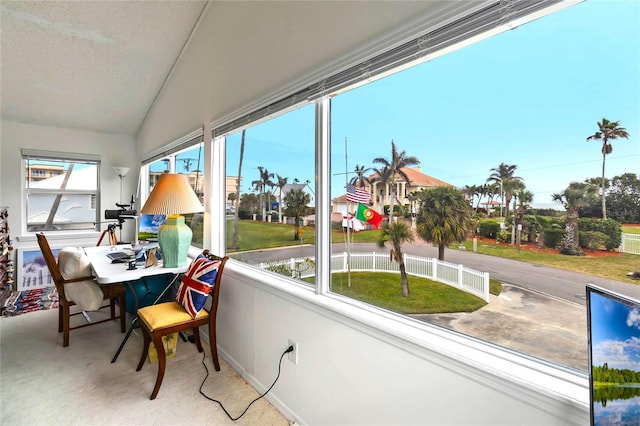 sunroom featuring lofted ceiling