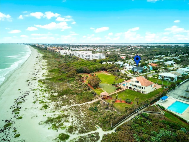 drone / aerial view with a water view and a view of the beach