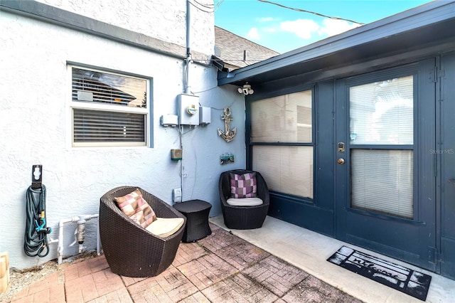 view of exterior entry featuring french doors