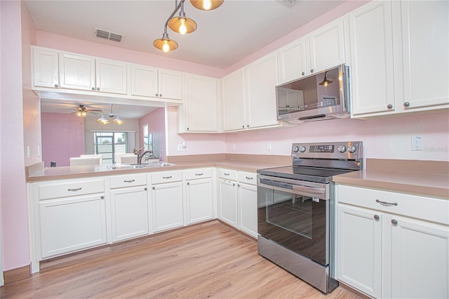 kitchen with hanging light fixtures, stainless steel appliances, white cabinetry, and ceiling fan