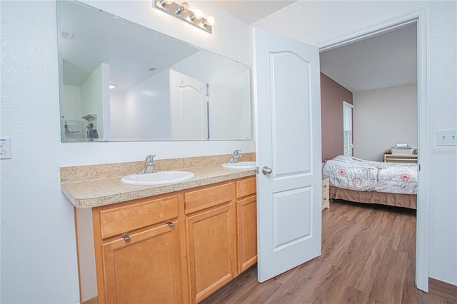 bathroom featuring vanity and hardwood / wood-style flooring