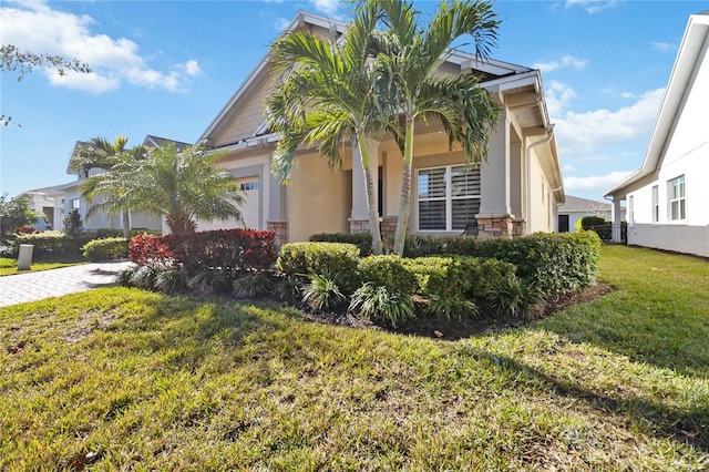 view of front of home with a garage and a front yard