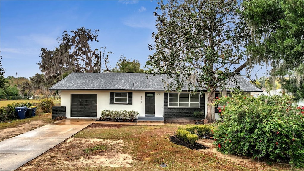 single story home with a garage