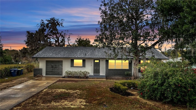 ranch-style house featuring a garage