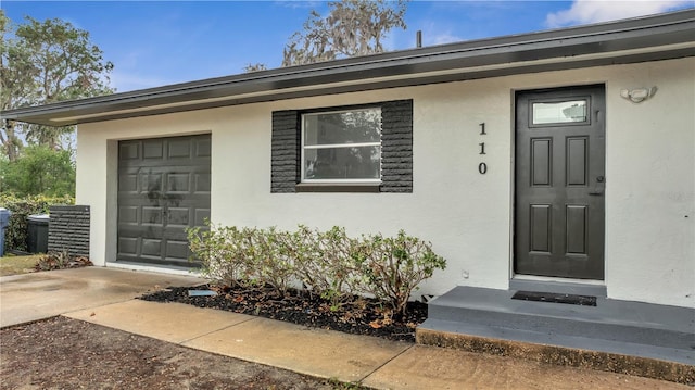 property entrance with a garage