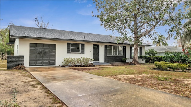 ranch-style house featuring a garage