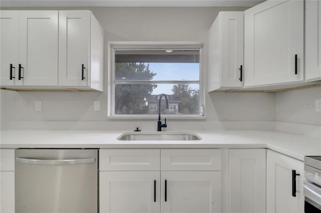 kitchen with sink, white cabinetry, stove, and stainless steel dishwasher