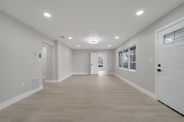 foyer entrance with light wood-type flooring