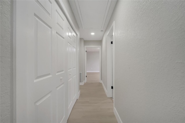 hall with light hardwood / wood-style floors