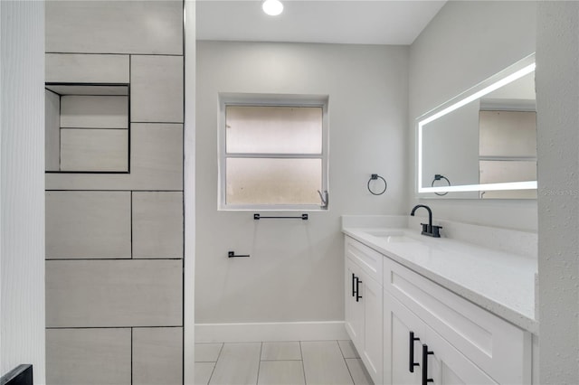 bathroom featuring tile patterned floors and vanity