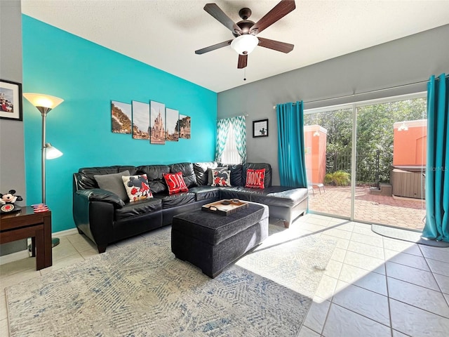 living room with tile patterned floors and ceiling fan