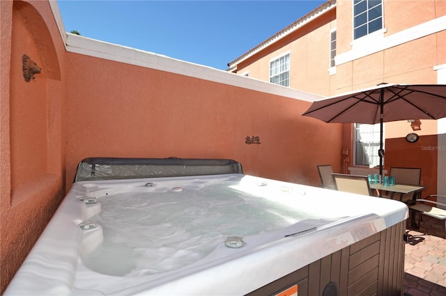 view of patio / terrace with a hot tub