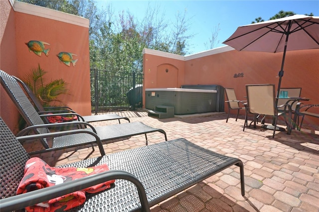 view of patio / terrace featuring a hot tub